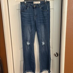 Blue Boot Cut Jeans with Distressed Details